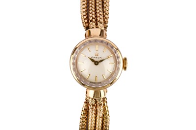 Lot 325 - OMEGA. A LADIES 9K GOLD AND DIAMOND SET MANUAL...