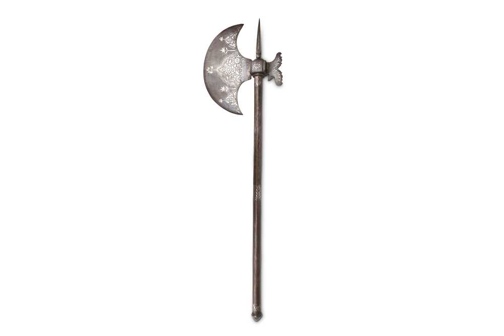 Lot 193 - A QAJAR SILVER-INLAID CEREMONIAL AXE (TABAR)...