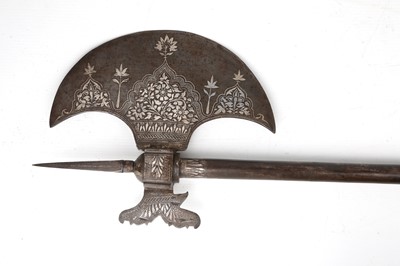 Lot 193 - A QAJAR SILVER-INLAID CEREMONIAL AXE (TABAR)...