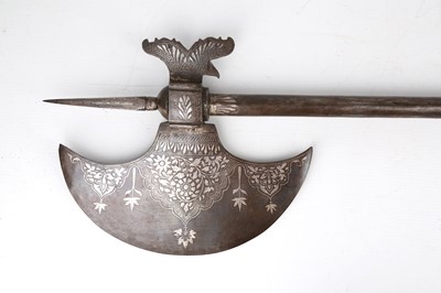 Lot 193 - A QAJAR SILVER-INLAID CEREMONIAL AXE (TABAR)...