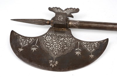 Lot 193 - A QAJAR SILVER-INLAID CEREMONIAL AXE (TABAR)...