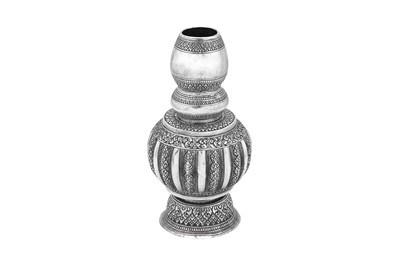 Lot 99 - A 20th century Cambodian unmarked silver bottle or vase, circa 1900-1950