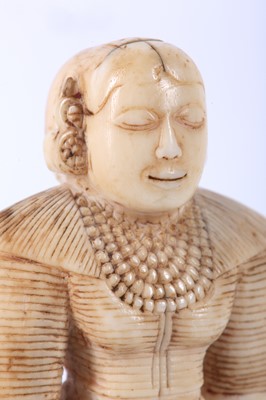 Lot 169 - A SINHALESE IVORY FIGURINE Sri Lanka, Kandyan...