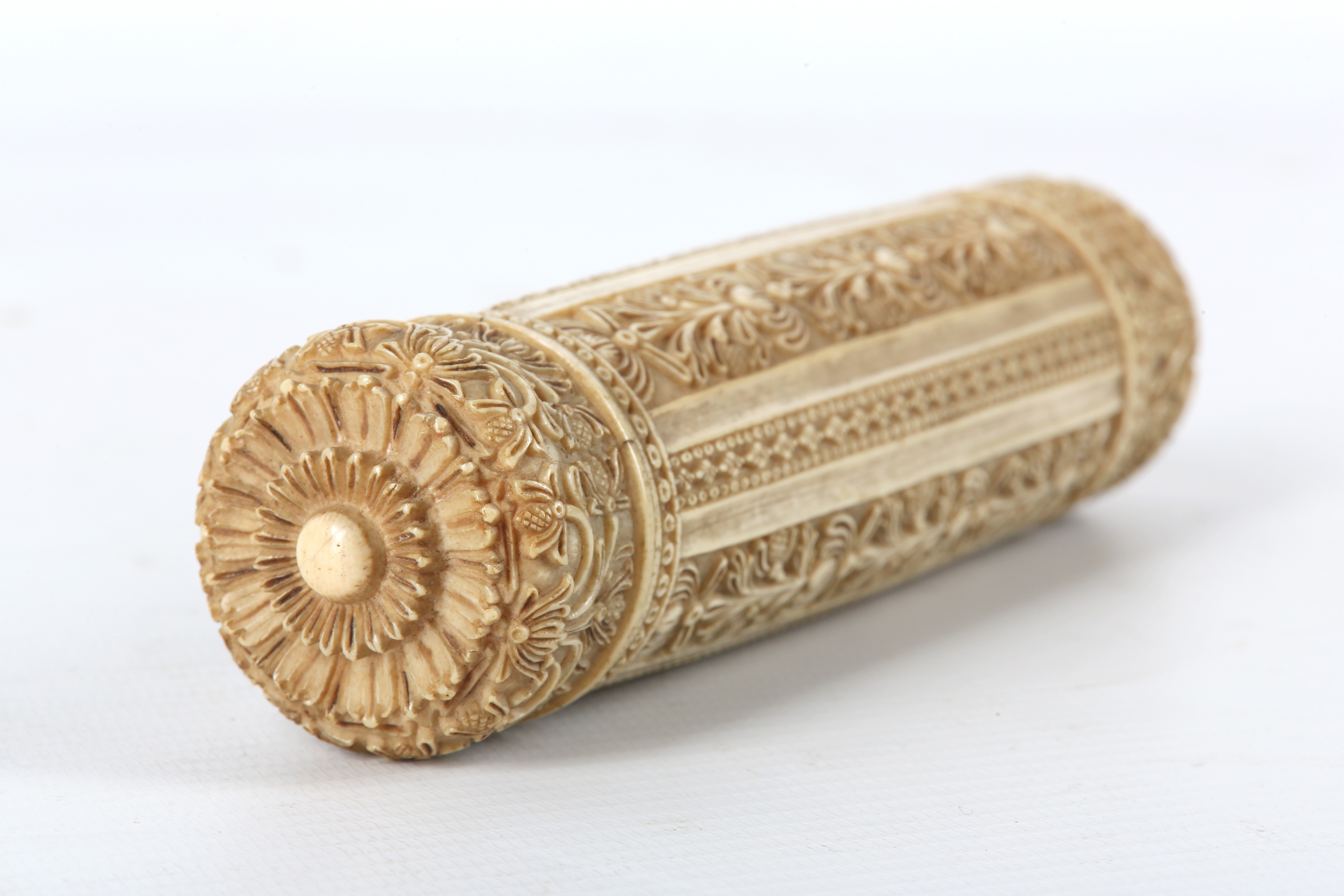 Lot 170 - A SINHALESE CARVED IVORY SCROLL CONTAINER