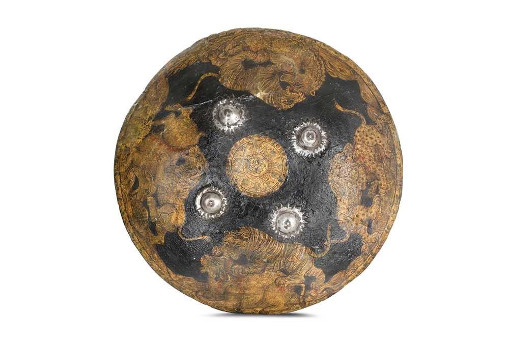 Lot 192 - A LACQUERED RAWHIDE SHIELD (DHAL) North India,...