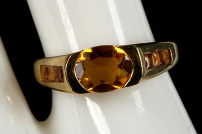 Lot 437 - A 9ct gold and citrine ring, with central oval...