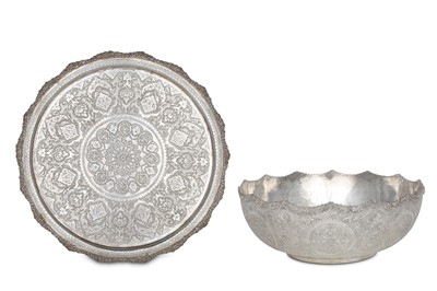 Lot 163 - A LATE QAJAR SET OF A SILVER BOWL AND TRAY...