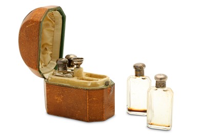 Lot 113 - A cased set of silver-mounted glass perfume...