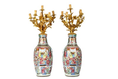 Lot 395 - A PAIR OF CHINESE FAMILLE ROSE VASES. Qing...