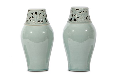 Lot 90 - A PAIR OF CELADON JARS AND COVERS. Korea....