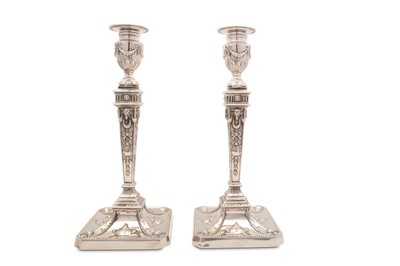 Lot 137 - A pair of silver plated candlesticks,...