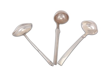 Lot 798 - Three Danish sterling silver sauce ladles by...