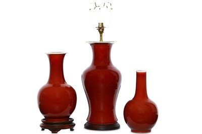 Lot 229 - THREE CHINESE OX BLOOD-GLAZED VASES. Qing...