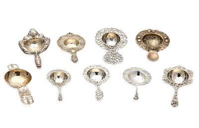 Lot 166 - A mixed group of nine silver tea strainers,...