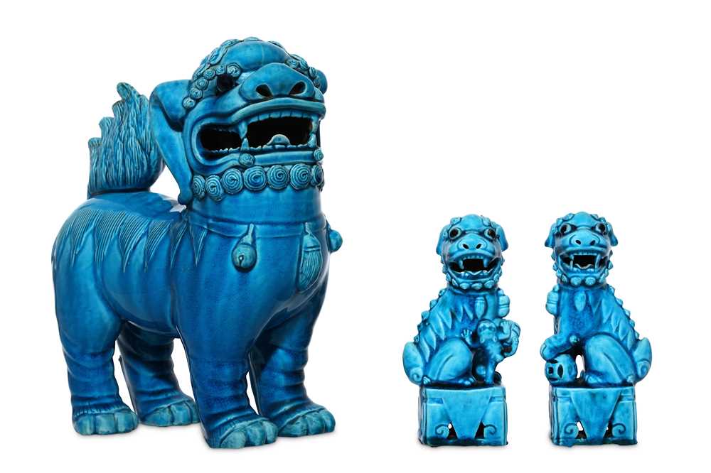 Lot 54 - THREE TURQUOISE-GLAZED BUDDHIST LION DOGS....