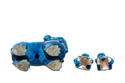 Lot 54 - THREE TURQUOISE-GLAZED BUDDHIST LION DOGS....