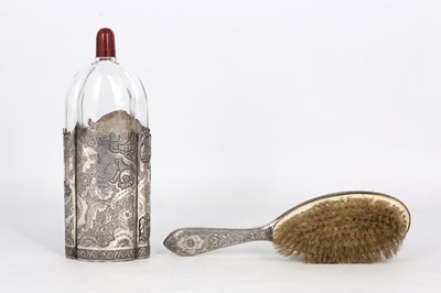 Lot 180 - A LATE QAJAR SILVER BRUSH AND GLASS BOTTLE ...