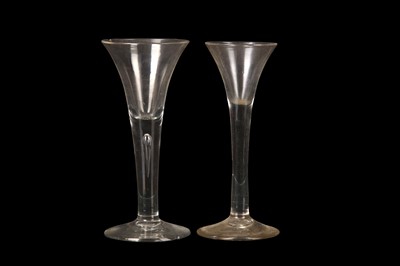 Lot 216 - TWO PLAIN-STEMMED WINE GLASSES, mid-18th...