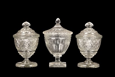 Lot 228 - THREE REGENCY CUT GLASS TABLE URNS OR...