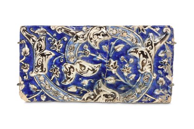 Lot 149 - A QAJAR MOULDED POTTERY TILE  Iran, late 19th -...