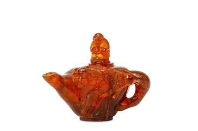 Lot 110 - A CHINESE CARVED AMBER WATER-DROPPER AND COVER....