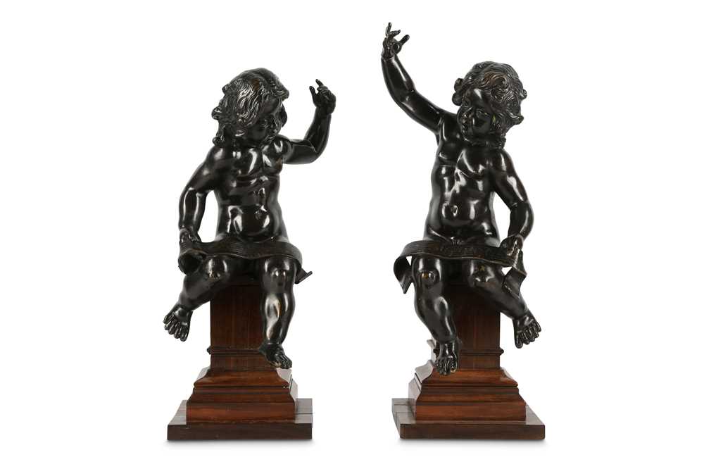 Lot 146 - A PAIR OF BRONZE PUTTI IN THE MANNER OF...