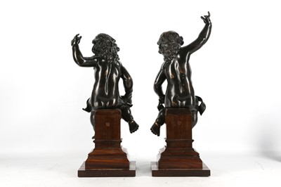 Lot 146 - A PAIR OF BRONZE PUTTI IN THE MANNER OF...