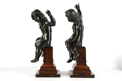 Lot 146 - A PAIR OF BRONZE PUTTI IN THE MANNER OF...