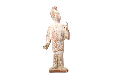 Lot 77 - A CHINESE POTTERY FIGURE. Tang Dynasty....