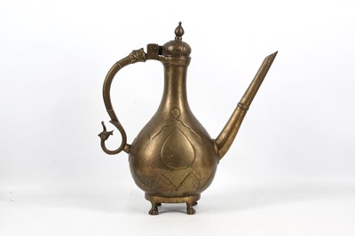 Lot 266 - AN INDIAN BRASS FOOTED EWER North India, 19th...