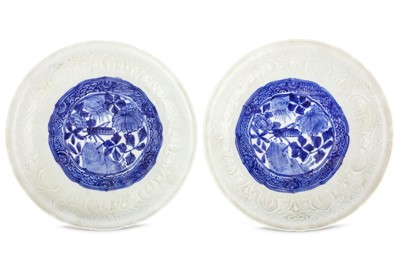 Lot 21 - A PAIR OF CHINESE MOULDED BLUE AND WHITE...