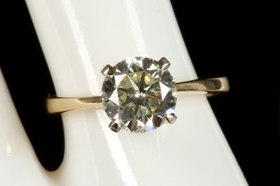 Lot 438 - An 18ct gold and diamond solitaire ring,...