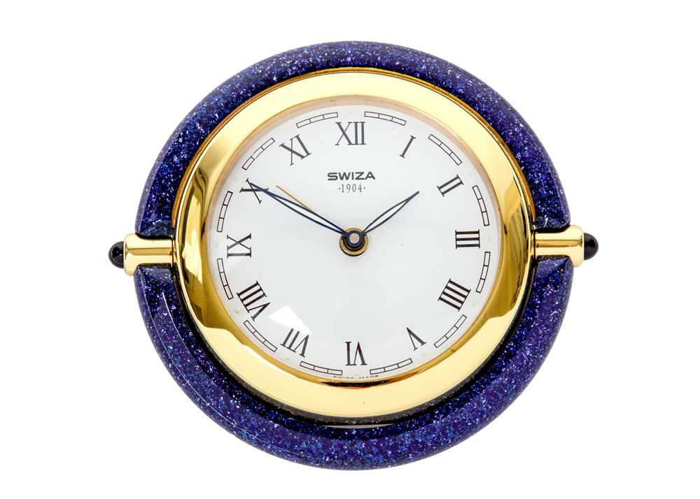 Lot 434 - SWIZA ALARM QUARTZ CLOCK. Maker: Swiza. Date:...