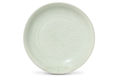 Lot 215 - A CHINESE INCISED WHITE-GLAZED DISH. Qing...