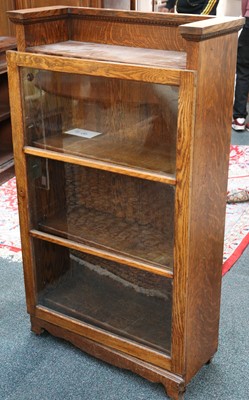 Lot 378 - An oak floor standing Arts & Crafts bookcase...