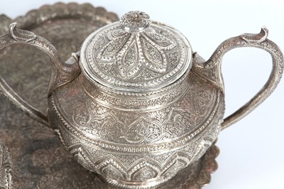 Lot 283 - A KASHMIRI WHITE METAL TEA SET Kashmir, North...