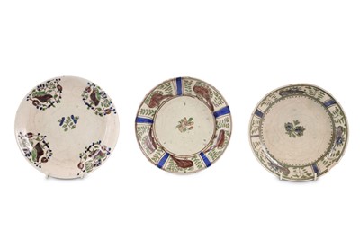 Lot 164 - * THREE LATE QAJAR POTTERY DISHES PROPERTY...