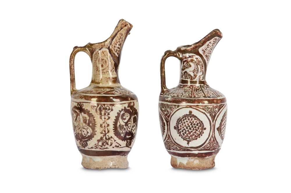 Lot 10 - * TWO SMALL COPPER-LUSTRE POTTERY EWERS ...