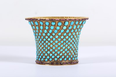 Lot 167 - * A QAJAR TURQUOISE-INSET GOLD QALYAN CUP...