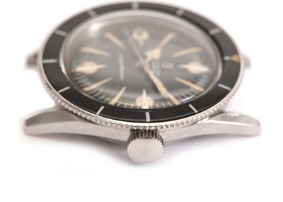 Lot 356 - BREITLING. A RARE STAINLESS STEEL AUTOMATIC...