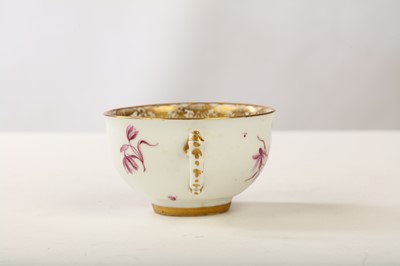 Lot 30 - A MEISSEN TEACUP, circa 1745, painted in puce...
