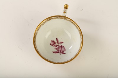 Lot 30 - A MEISSEN TEACUP, circa 1745, painted in puce...