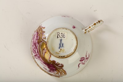 Lot 119 - A MEISSEN TEACUP, circa 1745, painted in puce...