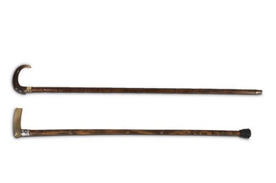 Lot 456 - TWO CANES WITH RHINOCEROS HORN HANDLES.  Circa...