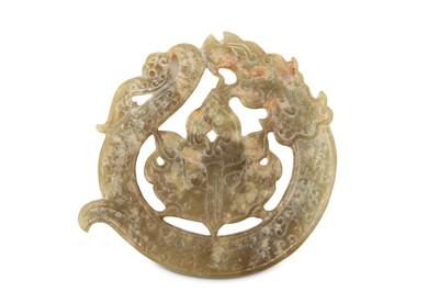Lot 556 - A Chinese carved jade pendant, in the style of...
