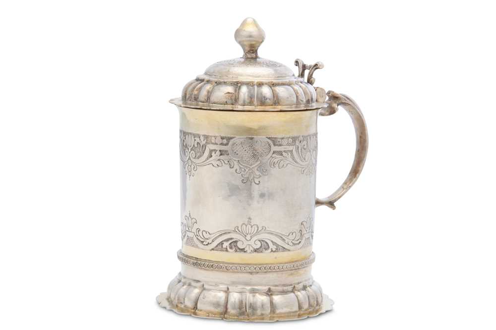 Lot 126 - A 18th century German parcel-gilt tankard,...