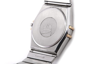 Lot 331 - OMEGA. A GENTS STAINLESS STEEL AND GOLD QUARTZ...