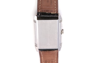Lot 347 - JAEGER-LECOULTRE. A STAINLESS STEEL DUAL TIME...