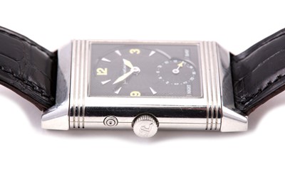 Lot 347 - JAEGER-LECOULTRE. A STAINLESS STEEL DUAL TIME...