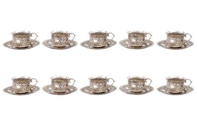 Lot 331 - A set of ten Indian silver cups and saucers,...